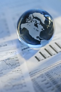 A globe on business papers.