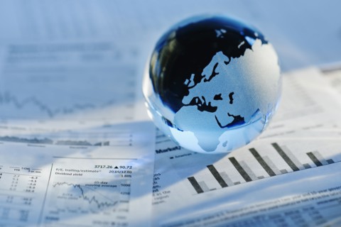 A globe on business papers.