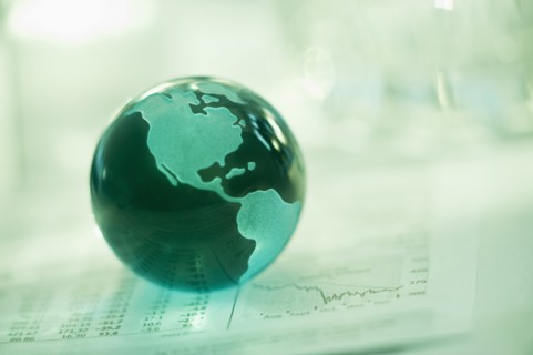 A globe on business papers.