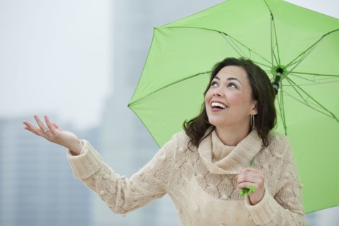 A woman outdoors in the rain.