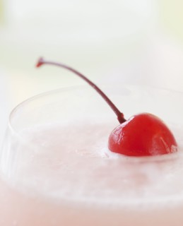 A milkshake with a cherry