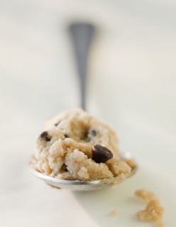 Chocolate chip cookie dough on a spoon