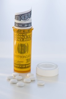 Pill bottle with bank notes