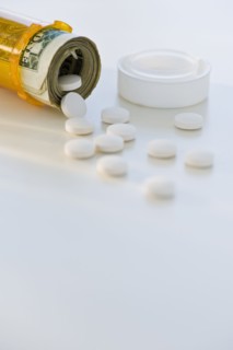 Pill bottle with bank notes