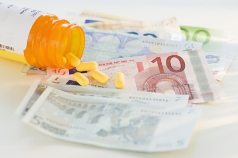 Pill bottle with bank notes
