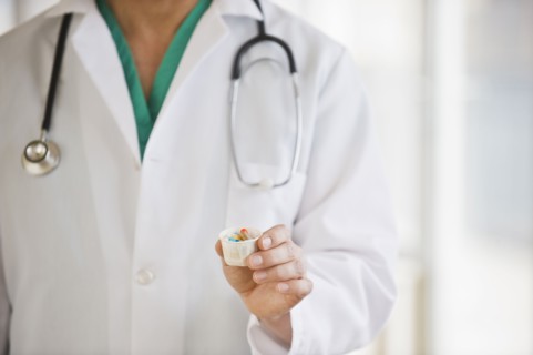 A doctor holding some medication
