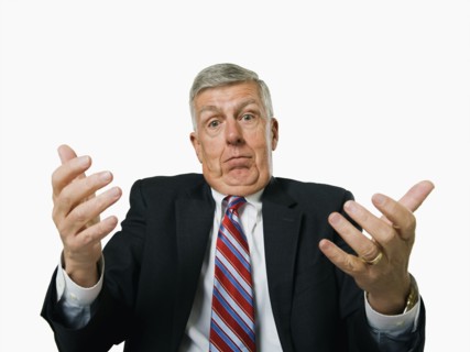 A businessman shrugging