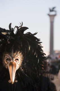 A person wearing a mask in in St. Mark's Square