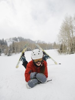 A downhill skier falling