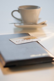 A credit card on a restaurant check.