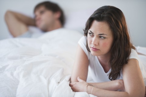 A couple in bed.