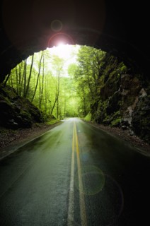 A scenic and empty road with tunnel