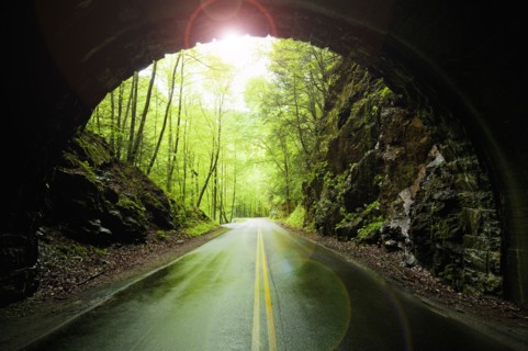 A scenic and empty road with tunnel