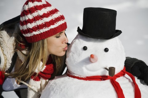 A woman with a snowman