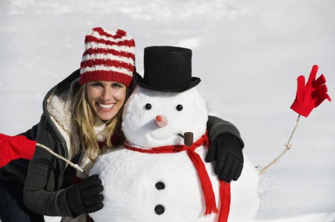 A woman with a snowman