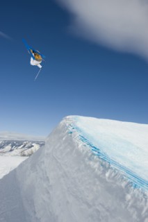 A downhill skier jumping