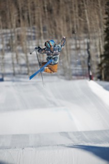 A downhill skier jumping