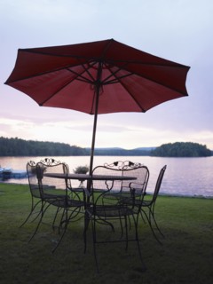 A patio set by a lake