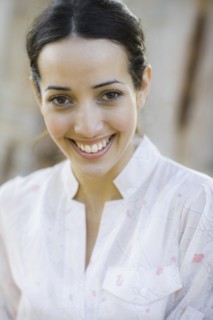 A woman outdoors smiling