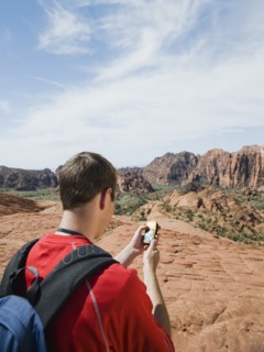 A man at Red Rock holding a GPS