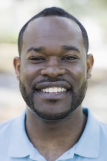 A man outdoors smiling