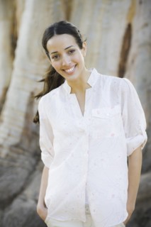 A woman outdoors smiling