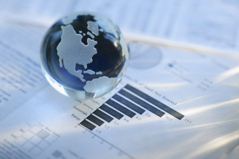 A globe on business papers.