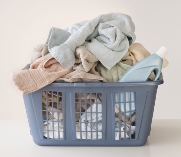 A laundry basket full of towels.