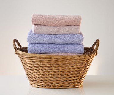 A laundry basket full of towels.