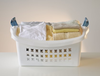 A laundry basket full of clothes.