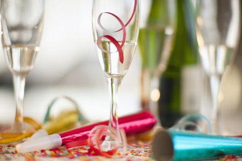 Champagne bottle and party supplies.