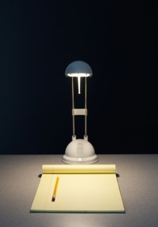Light and pad of paper.