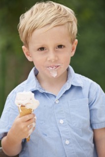 Child eating ice cream cone.