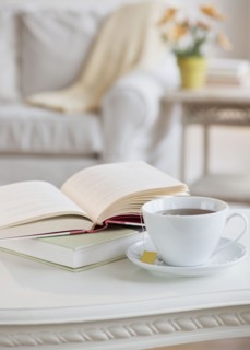 Coffee and book on table.