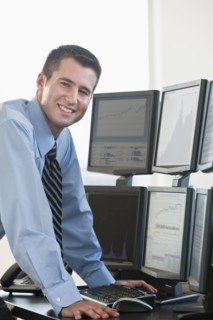 Trader at computer screens.