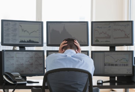 Frustrated male trader at work.