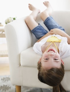 Child playing on sofa