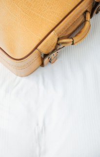 Suitcase on bed