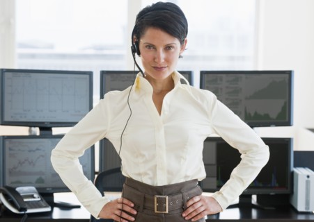 Female trader looking at camera.