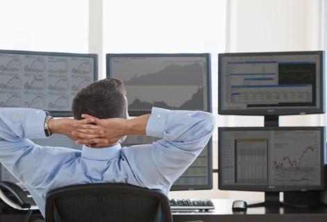 Relaxed male trader at work.