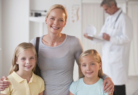 Mother and daughters at Doctor's office.