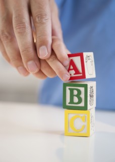 Child playing with ABC blocks.