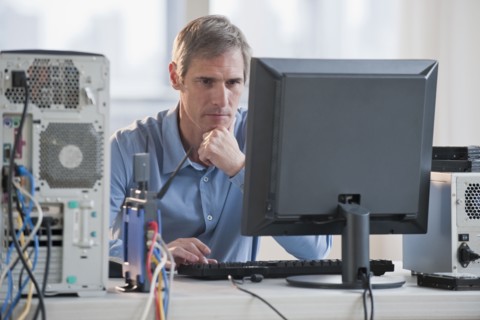 Man working on computer.