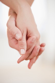 Couple holding hands.