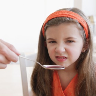Child turning up nose to medicine