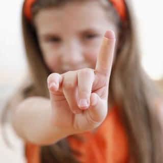 Child showing cut on finger