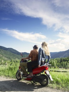 Young couple on scooter