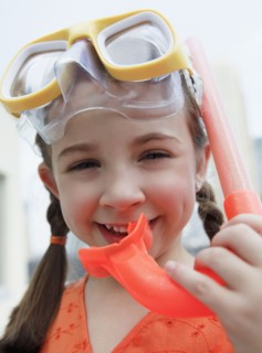 Child with mask and snorkel