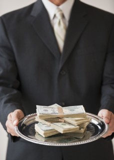 Money on silver platter.