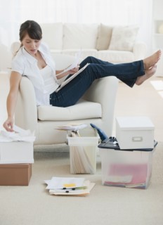 Woman organizing papers at home.